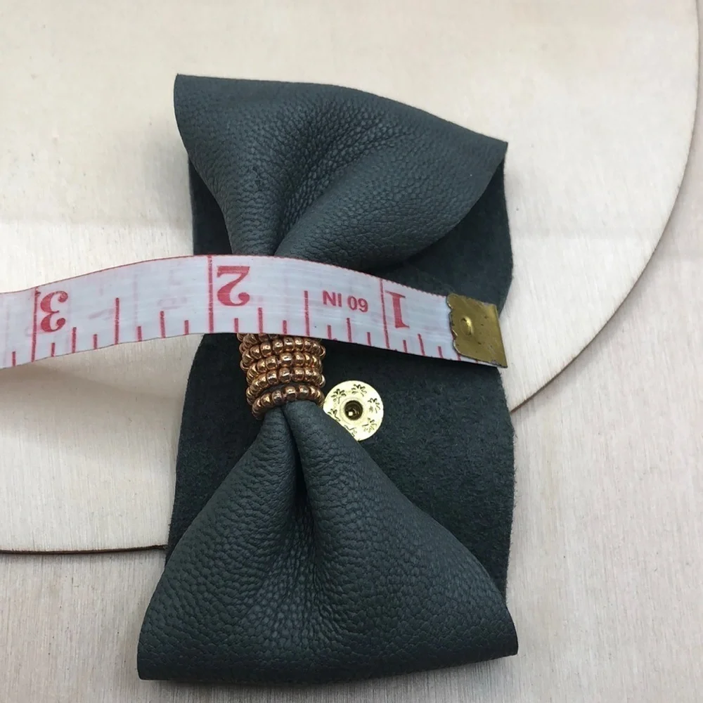 Soft leather bow shaped bracelet.